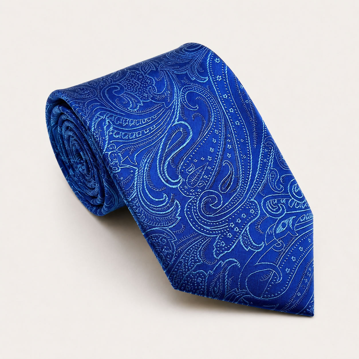 A rolled George Neale royal blue paisley silk tie.