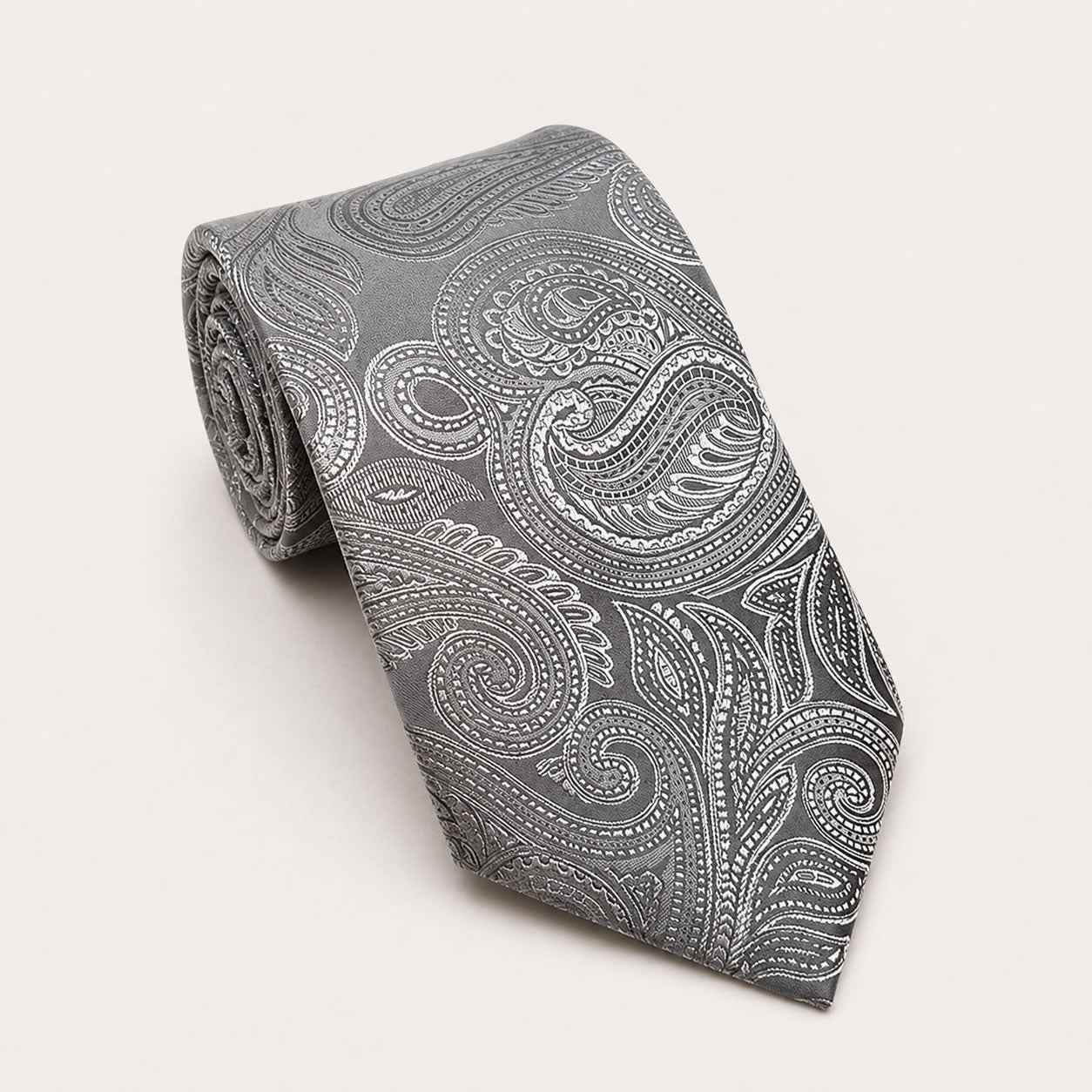 A rolled George Neale gunmetal silver paisley silk tie.