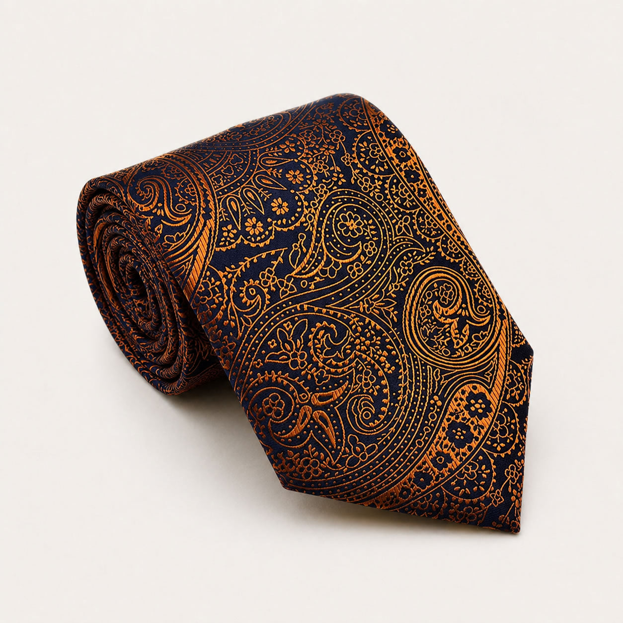 A rolled George Neale navy and bronze paisley silk tie.
