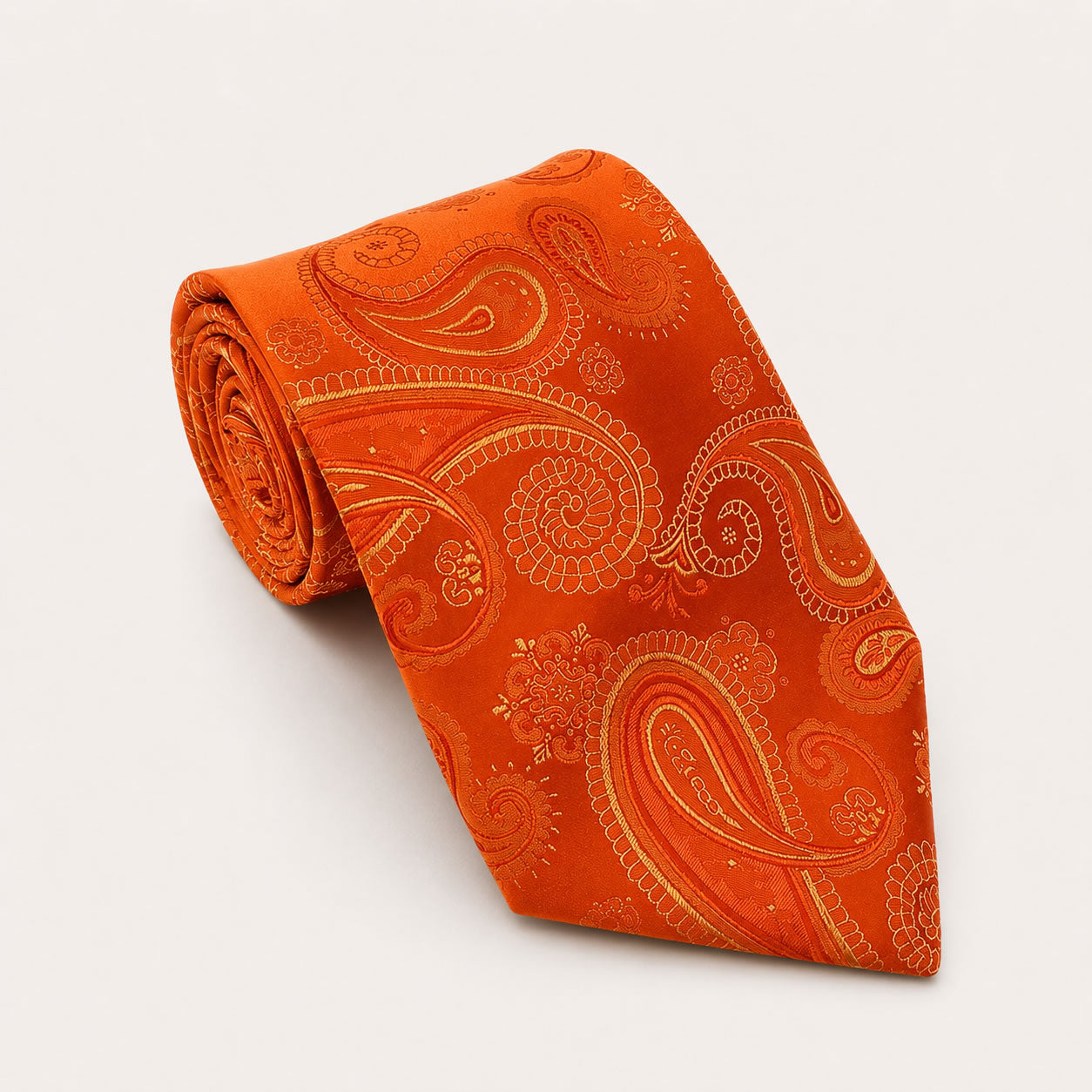 A rolled George Neale orange paisley silk tie.