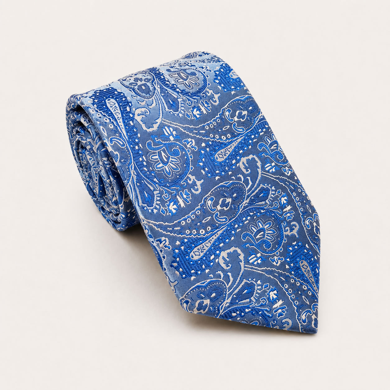 A rolled George Neale blue paisley silk tie.
