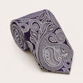 A rolled George Neale purple paisley silk tie.