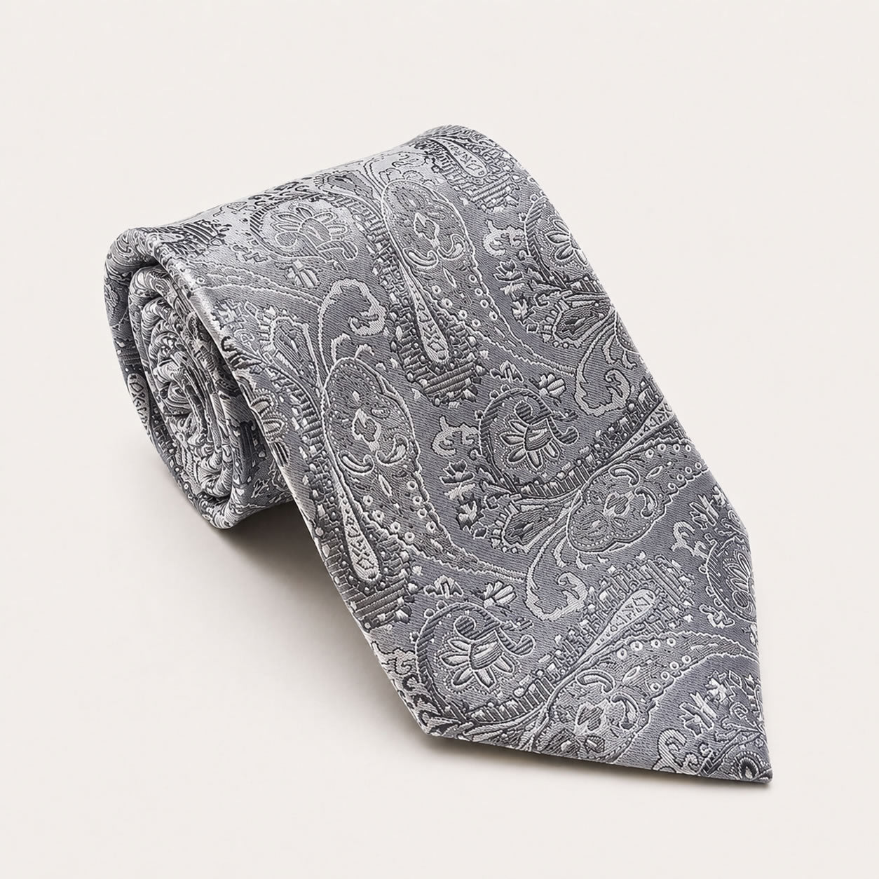 A rolled George Neale silver paisley silk tie.