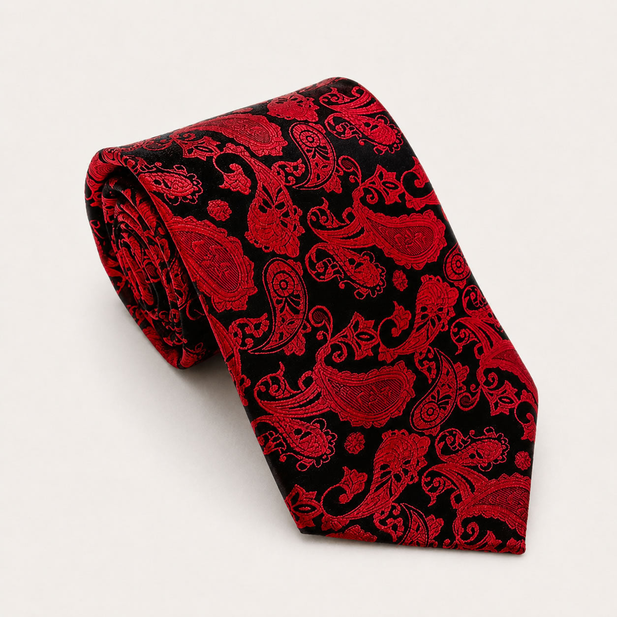 A rolled George Neale red and black paisley silk tie.