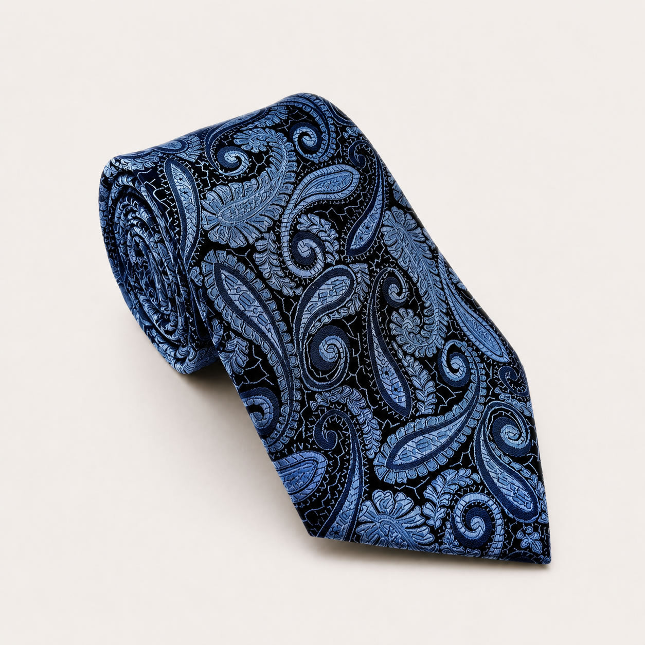 A rolled George Neale blue paisley silk tie.