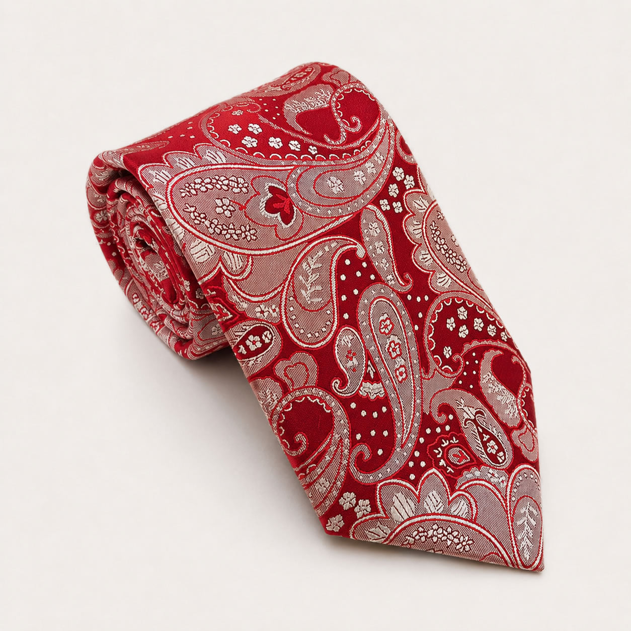 A rolled George Neale red paisley silk tie.
