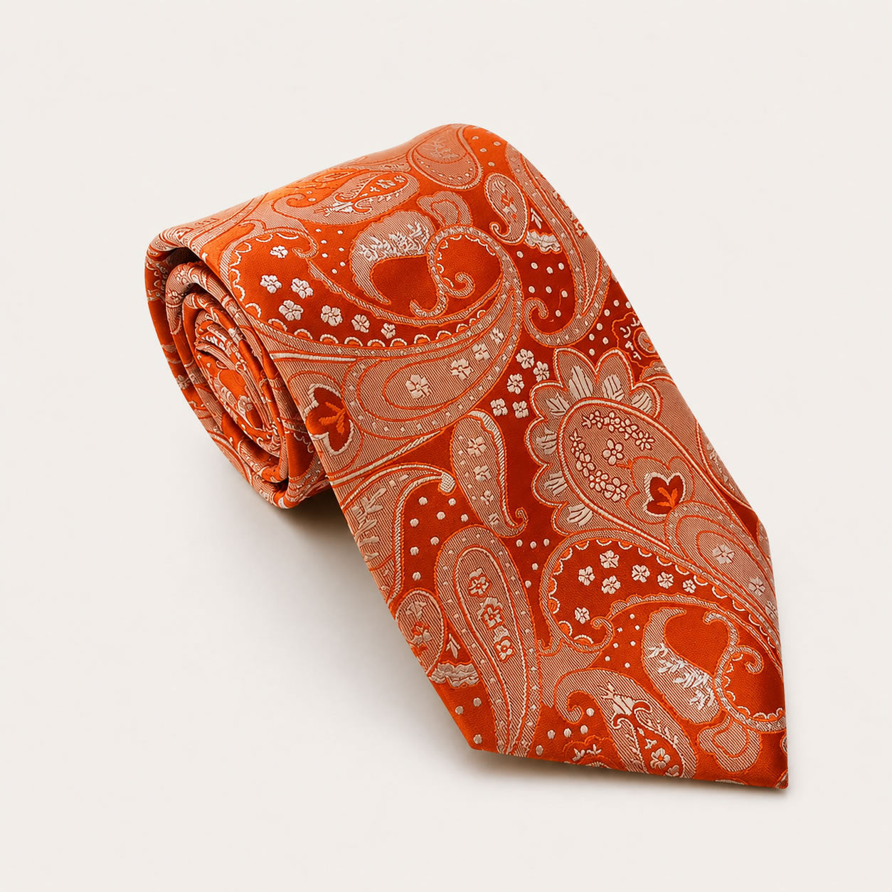 A rolled George Neale orange paisley silk tie.