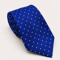 A rolled George Neale royal blue and gold polka dot silk tie.