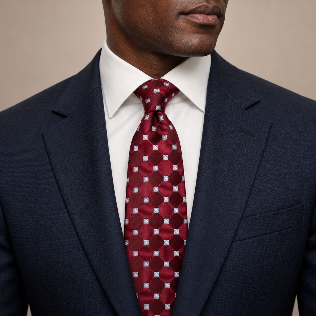 Burgundy and Light Blue Polka Dot Silk Tie by George Neale, worn by a model with a suit and shirt