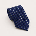 A rolled George Neale blue polka dot silk tie.