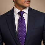 Purple and Gold Polka Dot Silk Tie by George Neale, worn by a model with a suit and shirt