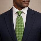 Green and Silver Polka Dot Silk Tie by George Neale, worn by a model with a suit and shirt