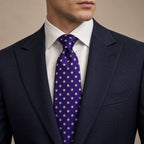 Purple and White Polka Dot Silk Tie by George Neale, worn by a model with a suit and shirt