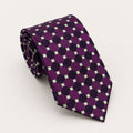 A rolled George Neale purple and green polka dot silk tie.