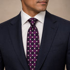 Purple and Green Polka Dot Silk Tie by George Neale, worn by a model with a suit and shirt