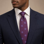 Purple Polka Dot Silk Tie by George Neale, worn by a model with a suit and shirt