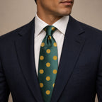 Forest Green and Gold Polka Dot Silk Tie by George Neale, worn by a model with a suit and shirt