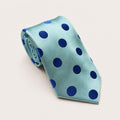 A rolled George Neale blue polka dot silk tie.