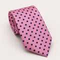 A rolled George Neale pink and navy polka dot silk tie.