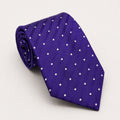 A rolled George Neale purple and white polka dot silk tie.