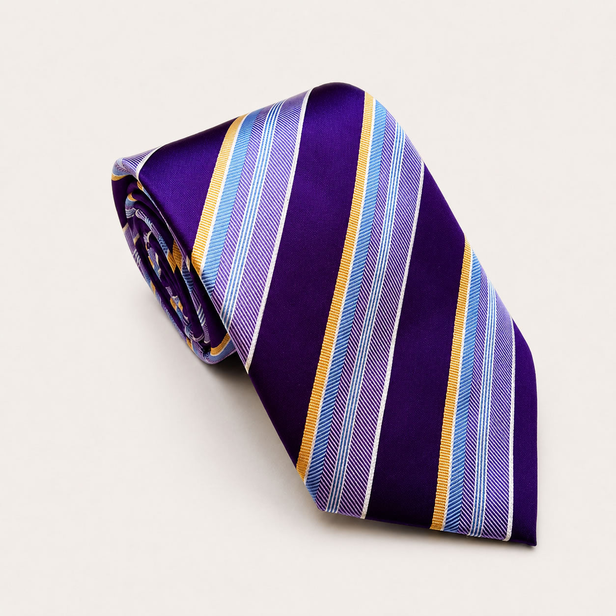 A rolled George Neale purple and gold stripe silk tie.