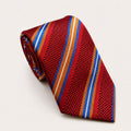 A rolled George Neale red and blue stripe silk tie.