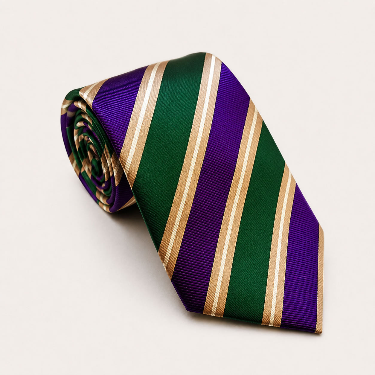 A rolled George Neale green and purple stripe silk tie.