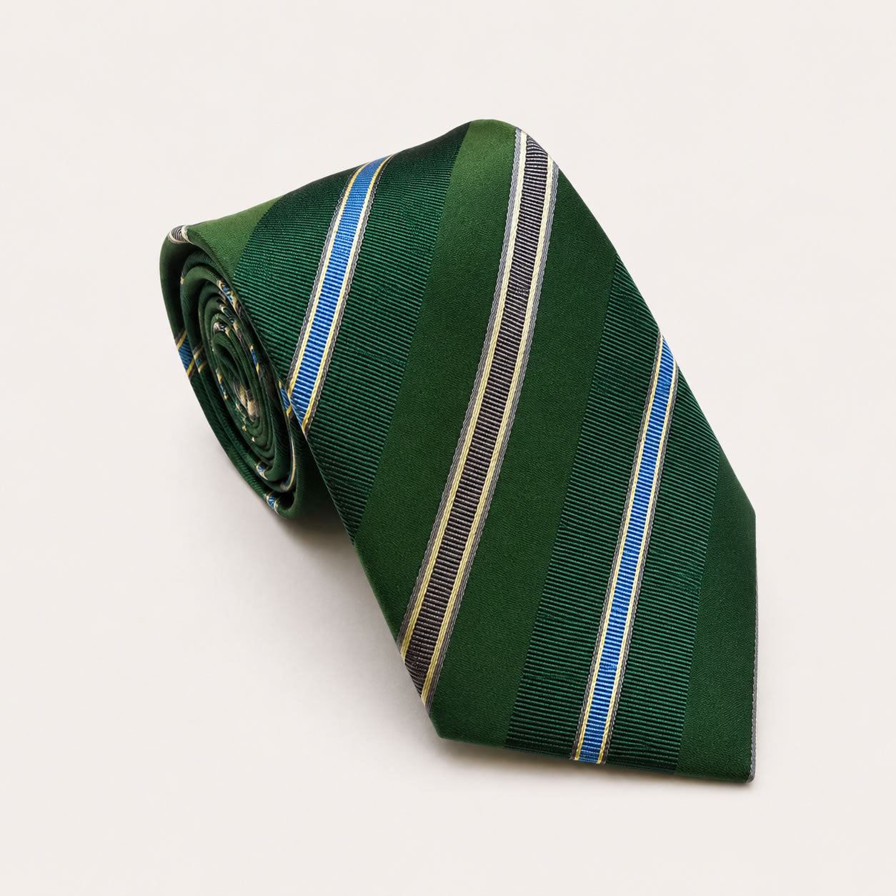 A rolled George Neale green and blue stripe silk tie.