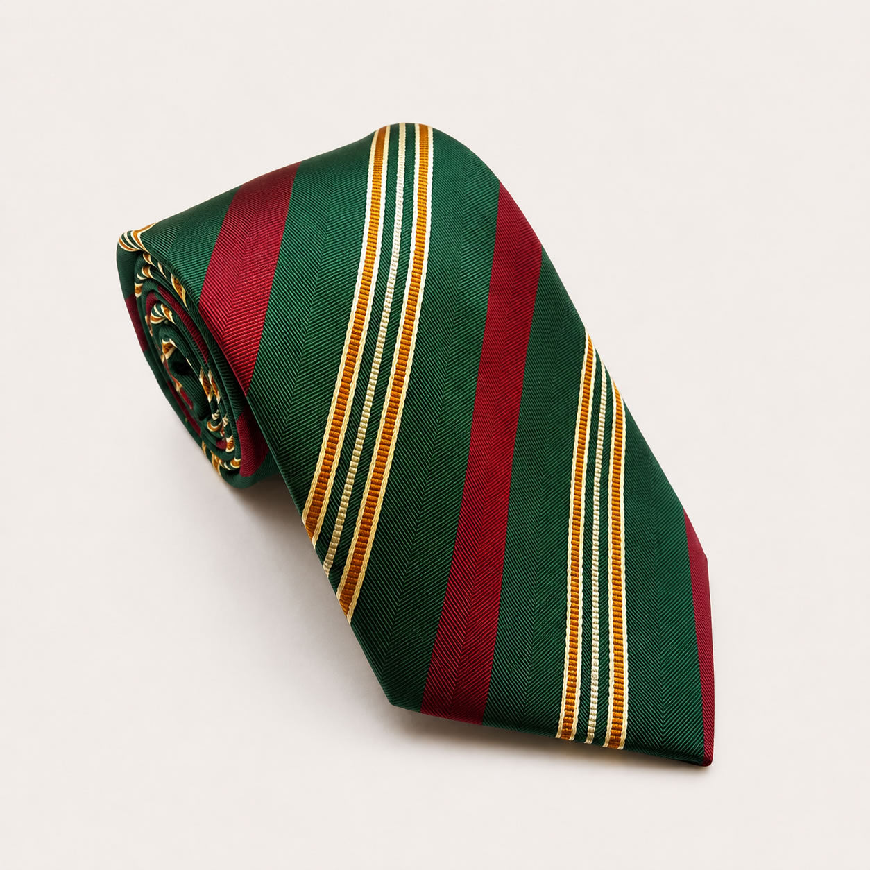A rolled George Neale green and red stripe silk tie.