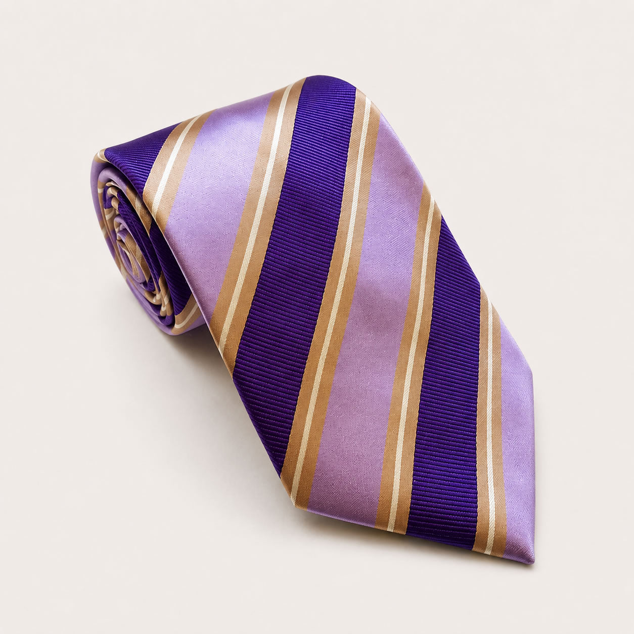A rolled George Neale purple and gold stripe silk tie.