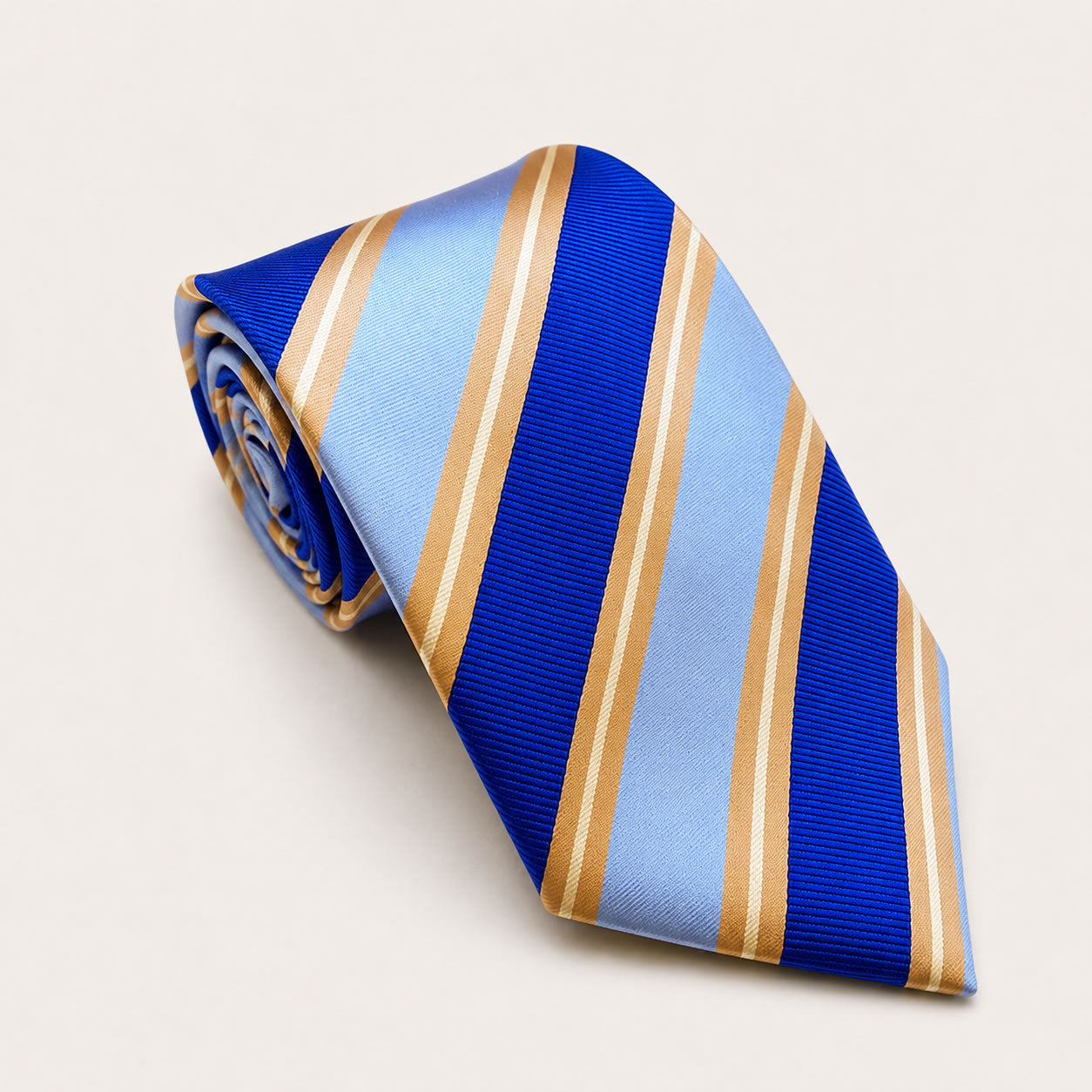 A rolled George Neale blue and gold stripe silk tie.