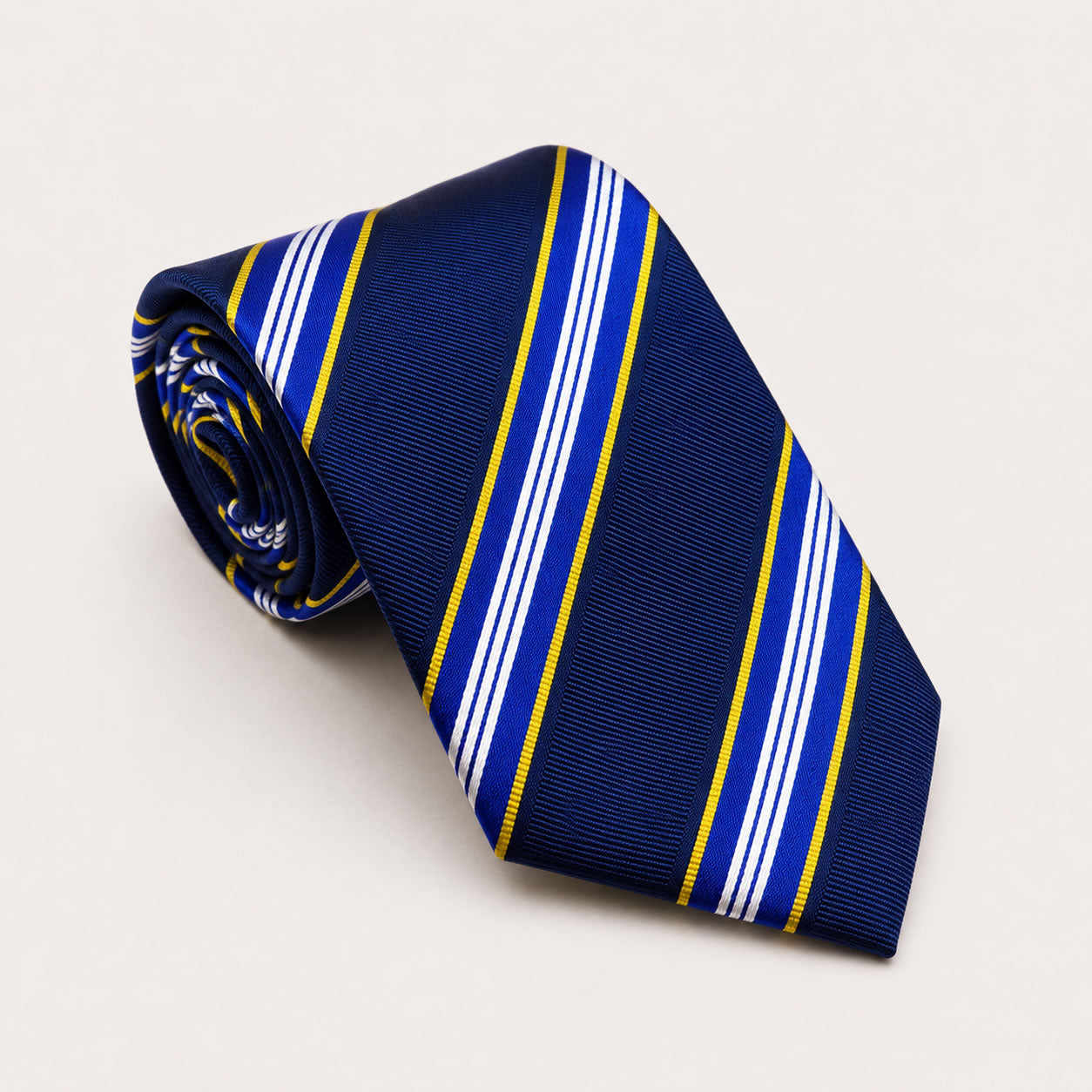 A rolled George Neale navy and gold stripe silk tie.