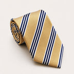 A rolled George Neale champagne and navy stripe silk tie.