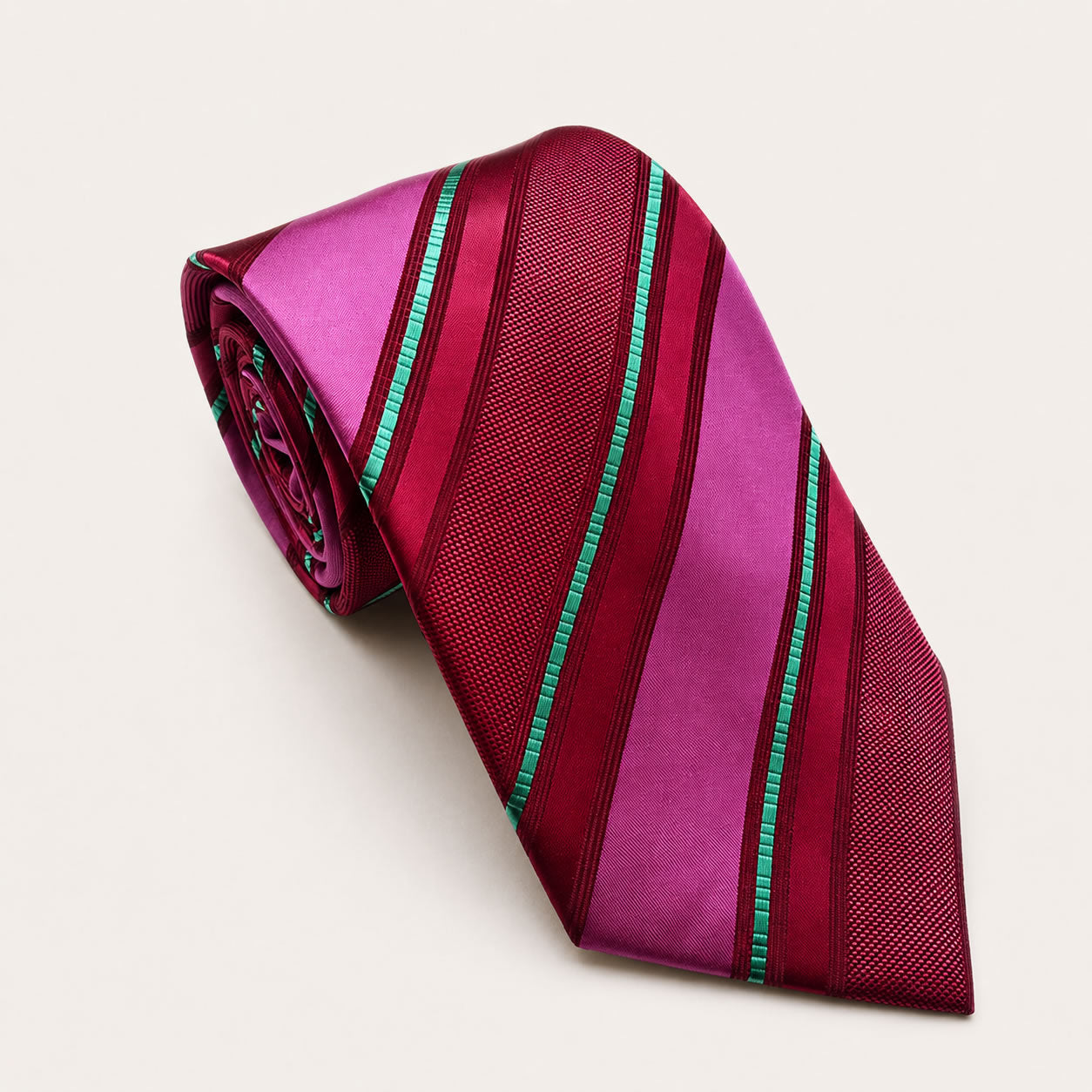 A rolled George Neale fuchsia and maroon stripe silk tie.
