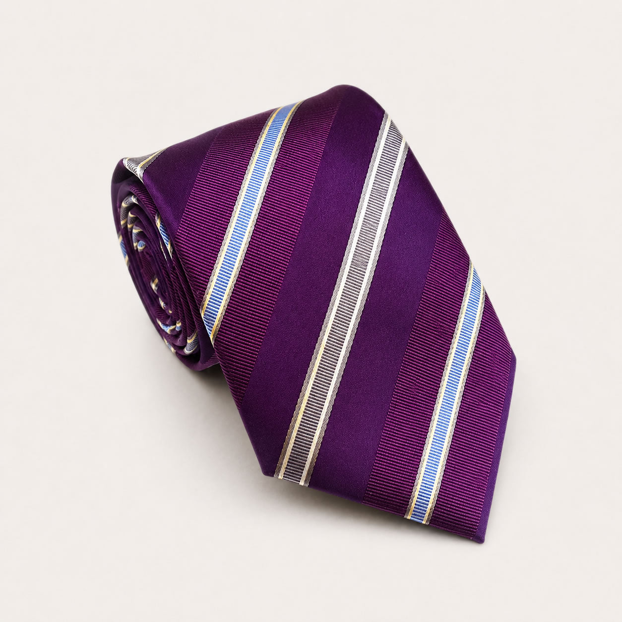 A rolled George Neale purple stripe silk tie.