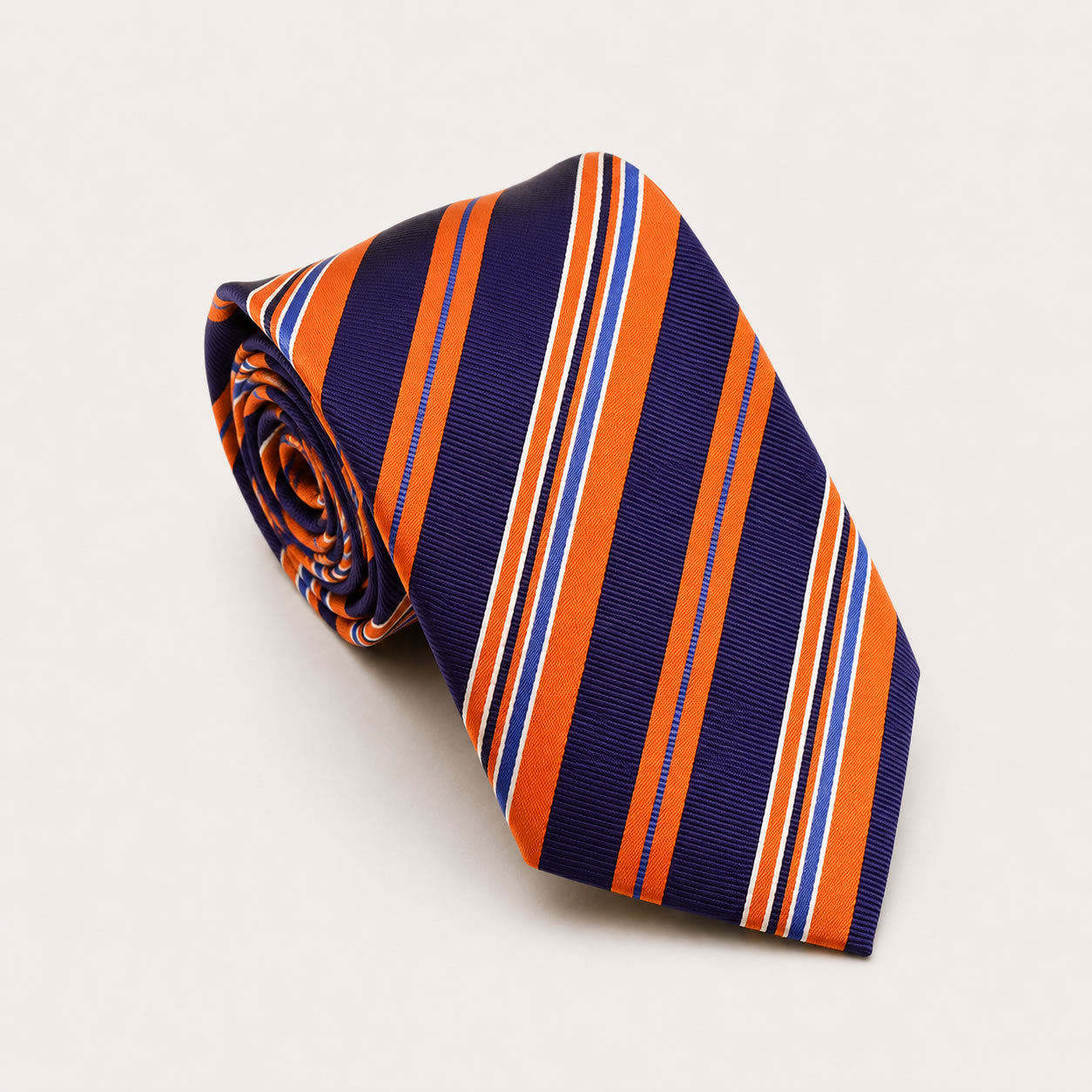 A rolled George Neale navy and orange stripe silk tie.