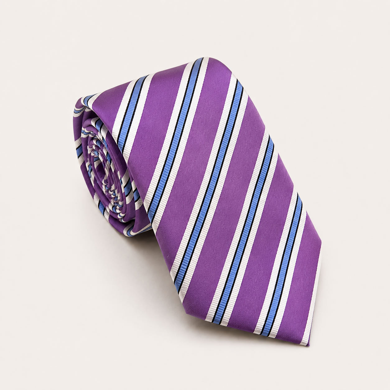 A rolled George Neale purple and blue stripe silk tie.