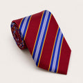 A rolled George Neale red and blue stripe silk tie.