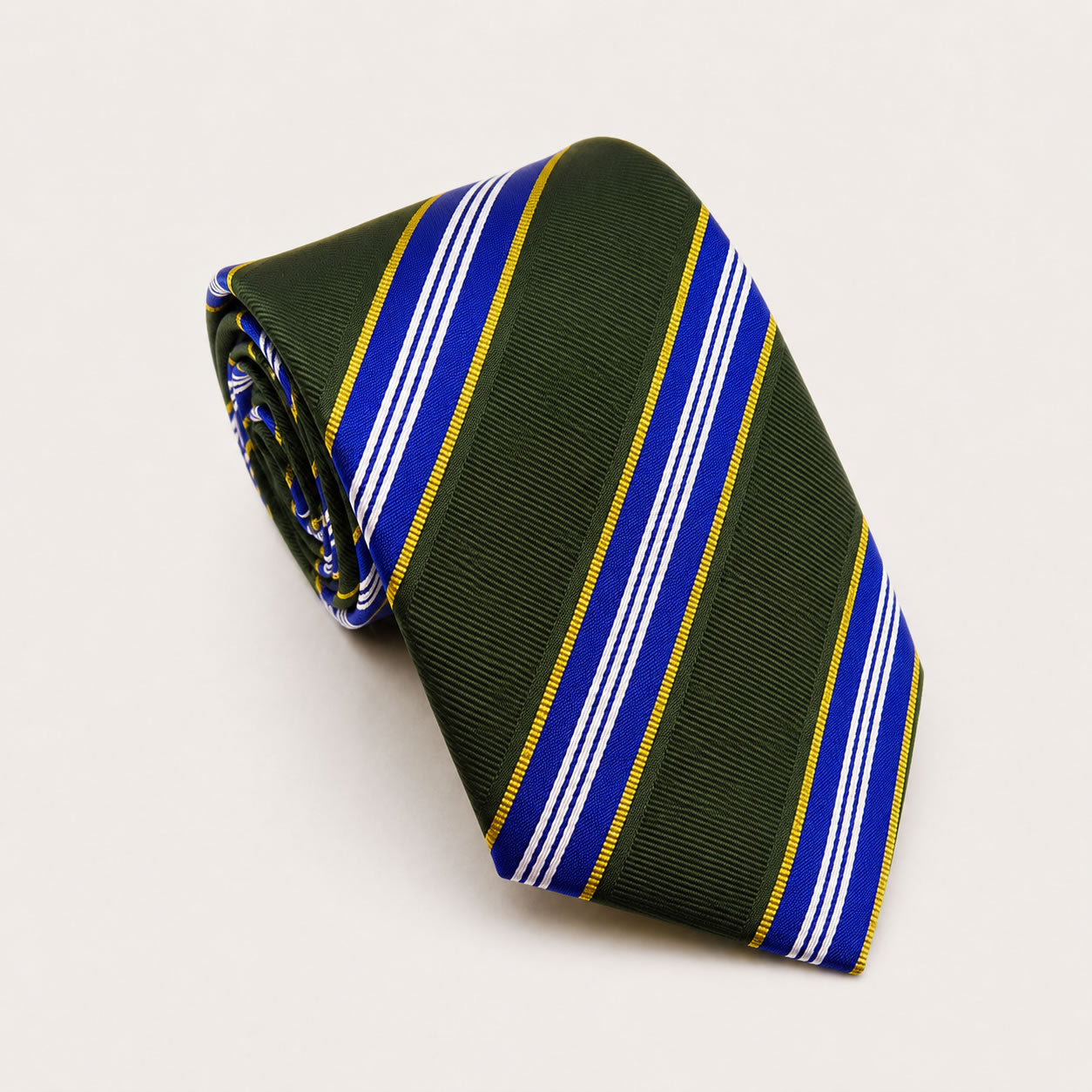 A rolled George Neale green and blue stripe silk tie.