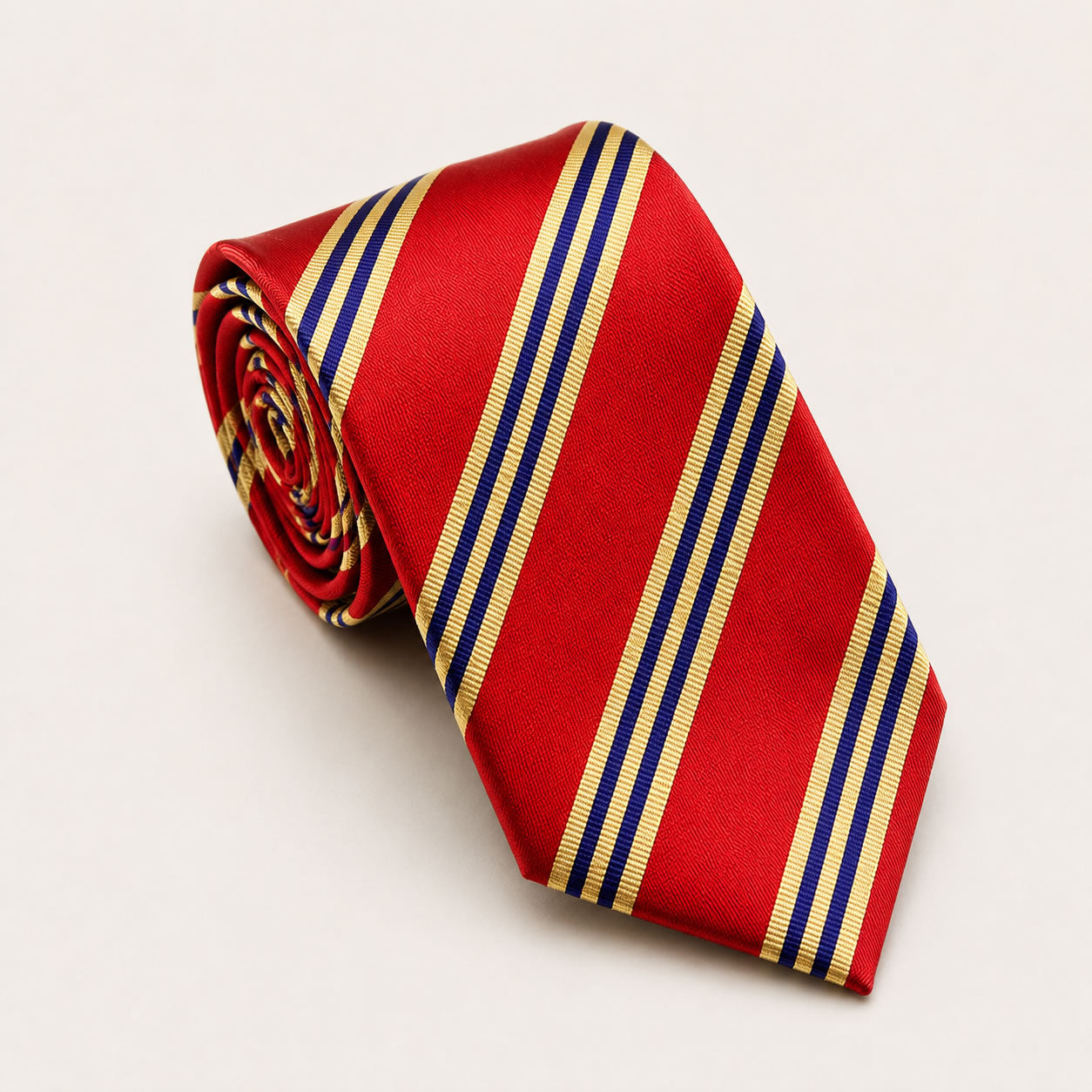 A rolled George Neale red and navy stripe silk tie.
