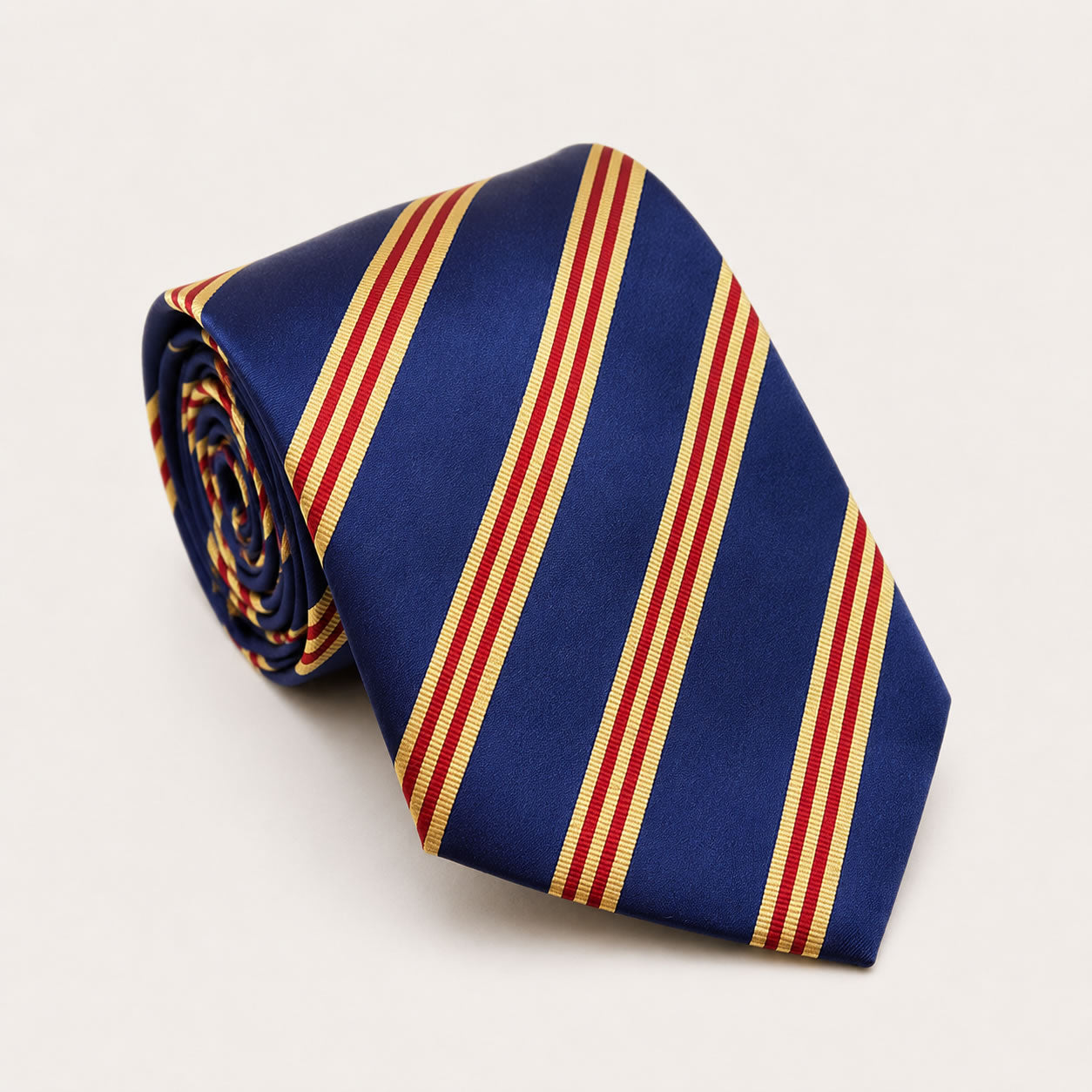 A rolled George Neale navy and red stripe silk tie.