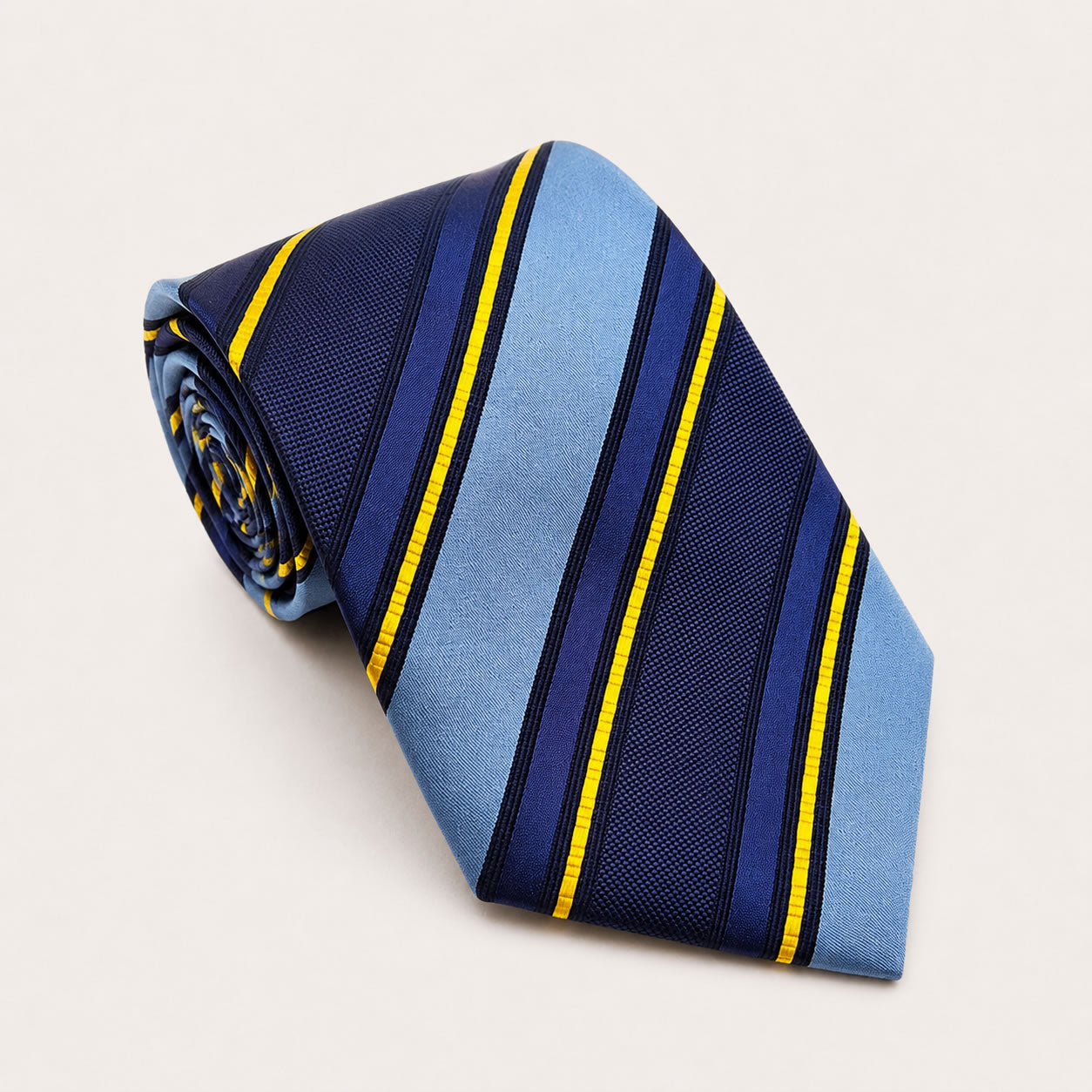 A rolled George Neale blue stripe silk tie.