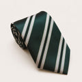 A rolled George Neale dark green and silver stripe silk tie.