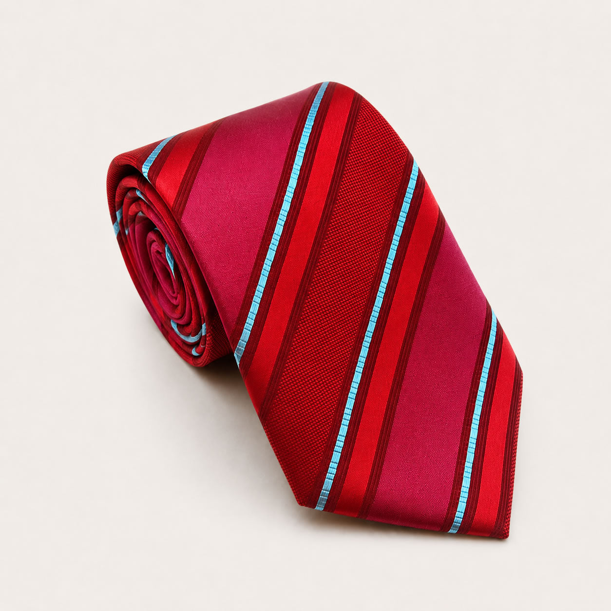A rolled George Neale red and blue stripe silk tie.
