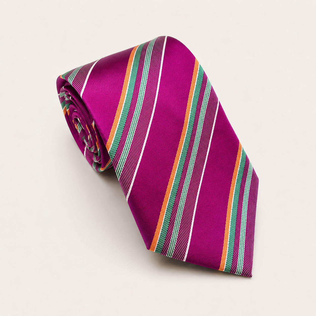 A rolled George Neale fuchsia and green stripe silk tie.