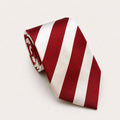 A rolled George Neale burgundy and white stripe silk tie.