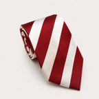 A rolled George Neale burgundy and white stripe silk tie.