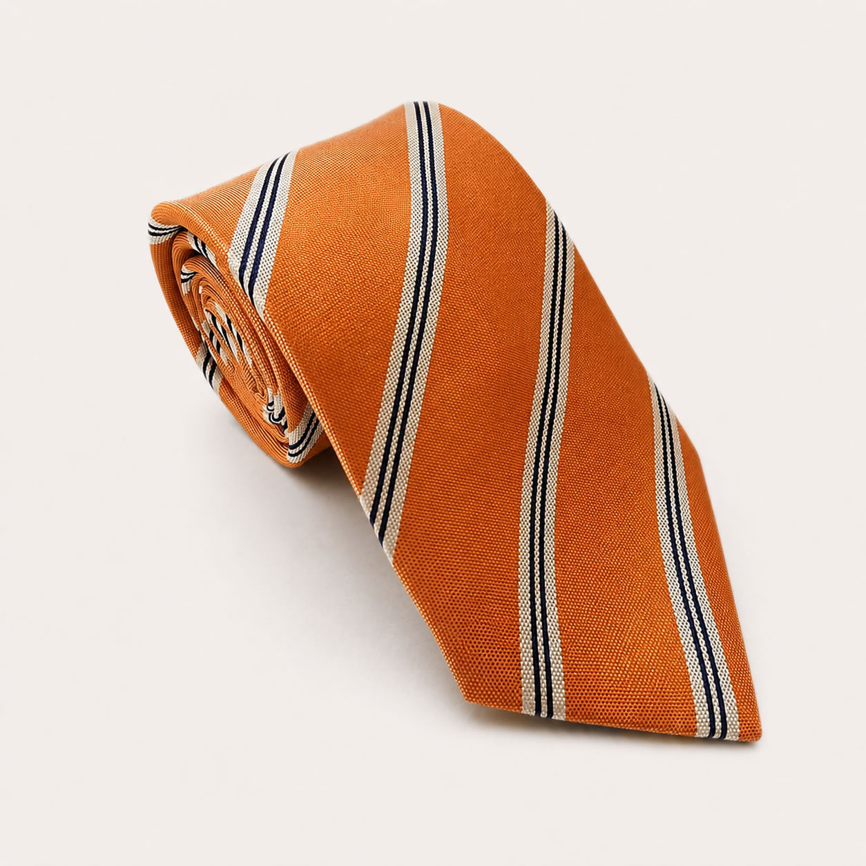 A rolled George Neale orange stripe silk tie.
