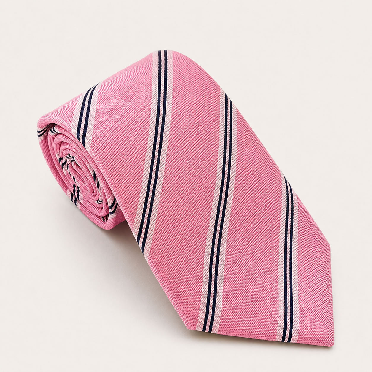 A rolled George Neale pink stripe silk tie.