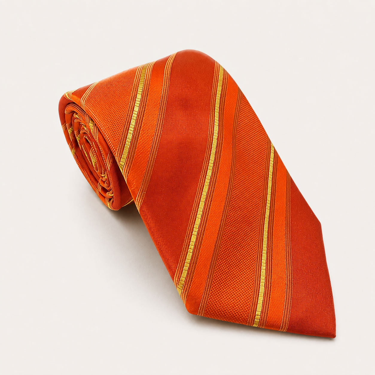A rolled George Neale orange and gold stripe silk tie.